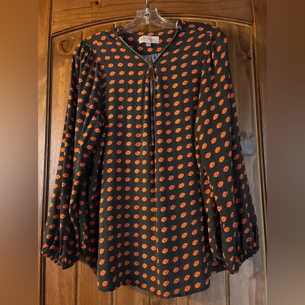 Philosophy 1X Women’s top. Black with red lips. Zipper halfway up top.